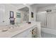 Well-lit bathroom features a shower and tub combination, ceramic tile floor, and a large mirror at 3510 Smoke Rise Way, Lawrenceville, GA 30044