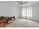 Bedroom with carpet, white walls, and cardboard boxes with view of exterior through window at 3510 Smoke Rise Way, Lawrenceville, GA 30044