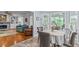 Cozy dining room sits adjacent to a sunroom and living room with fireplace at 3510 Smoke Rise Way, Lawrenceville, GA 30044
