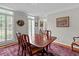 Bright dining room featuring hardwood table, chairs and natural light at 3510 Smoke Rise Way, Lawrenceville, GA 30044