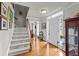 Bright entryway features hardwood floors, a staircase, and a clear view of the front door at 3510 Smoke Rise Way, Lawrenceville, GA 30044