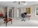 Spacious home office features neutral colored walls, plush carpet and multiple entry doors at 3510 Smoke Rise Way, Lawrenceville, GA 30044