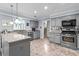 Stylish kitchen with gray cabinets, granite countertops, and stainless steel appliances at 3510 Smoke Rise Way, Lawrenceville, GA 30044