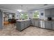 Modern kitchen with gray cabinetry, granite countertops, and stainless steel appliances at 3510 Smoke Rise Way, Lawrenceville, GA 30044