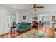 Cozy living room with ceiling fan and easy access to the kitchen at 3510 Smoke Rise Way, Lawrenceville, GA 30044