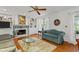 Bright living room with hardwood floors, fireplace, and built-in shelving at 3510 Smoke Rise Way, Lawrenceville, GA 30044
