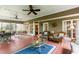Relax on this charming screened porch with a swing, comfortable seating, and a view of the backyard at 3510 Smoke Rise Way, Lawrenceville, GA 30044