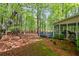 Large wooded backyard with deck, patio, and shade trees at 3927 Collier Nw Trce, Kennesaw, GA 30144