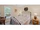 Bedroom featuring double bed, desk, side tables, and window at 3927 Collier Nw Trce, Kennesaw, GA 30144