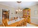 Traditional dining room with hardwood floors and a view into the kitchen area at 3927 Collier Nw Trce, Kennesaw, GA 30144