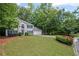 Traditional-style home with a two-car garage and a neatly landscaped yard in a lush setting at 3927 Collier Nw Trce, Kennesaw, GA 30144