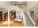Bright foyer showcasing a staircase, hardwood floors and an open view to living spaces at 3927 Collier Nw Trce, Kennesaw, GA 30144