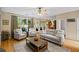 Bright living room featuring neutral tones, recessed lighting, an area rug, and access to other rooms in the home at 3927 Collier Nw Trce, Kennesaw, GA 30144