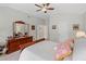 A neutral primary bedroom featuring a tray ceiling, light-colored walls, and carpeted floors at 3927 Collier Nw Trce, Kennesaw, GA 30144