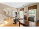 Hardwood-floored office area featuring a desk, exercise equipment, and natural light at 3927 Collier Nw Trce, Kennesaw, GA 30144