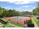 Community tennis courts surrounded by trees, benches, and a paved walkway at 3927 Collier Nw Trce, Kennesaw, GA 30144