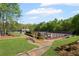 Scenic tennis court area featuring pristine courts, landscaping, and community seating at 3927 Collier Nw Trce, Kennesaw, GA 30144