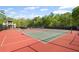 Multiple tennis courts with professional surfaces, surrounded by well-maintained landscaping at 3927 Collier Nw Trce, Kennesaw, GA 30144