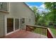 Wooden deck with sliding door overlooking a grassy backyard at 4368 Heritage Glen Ct, Marietta, GA 30068