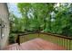 Lovely wooden back deck with railings overlooking a grassy backyard at 4368 Heritage Glen Ct, Marietta, GA 30068