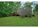 Lovely backyard with a wooden deck, large lawn, and mature trees at 4368 Heritage Glen Ct, Marietta, GA 30068