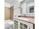 This bathroom has a large framed mirror and a granite topped vanity with sink at 4368 Heritage Glen Ct, Marietta, GA 30068