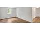 Bedroom with hardwood floors and a window, showing the closet and hallways at 4368 Heritage Glen Ct, Marietta, GA 30068
