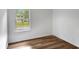 Bright bedroom with hardwood floors and window view at 4368 Heritage Glen Ct, Marietta, GA 30068