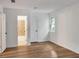 This bedroom features hardwood floors, a window, a walk in bathroom and a closet at 4368 Heritage Glen Ct, Marietta, GA 30068