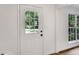 Bright entryway door with window and side windows, freshly painted white trim and neutral paint at 4368 Heritage Glen Ct, Marietta, GA 30068
