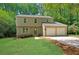 Charming two-story home with a well-maintained lawn, complemented by fresh landscaping and a convenient two-car garage at 4368 Heritage Glen Ct, Marietta, GA 30068