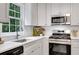 Bright kitchen featuring stainless appliances and white countertops and cabinets at 4368 Heritage Glen Ct, Marietta, GA 30068