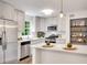 Modern kitchen featuring stainless steel appliances, white countertops, and white cabinets at 4368 Heritage Glen Ct, Marietta, GA 30068