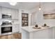 Modern kitchen with stainless steel appliances, white countertop, and open layout at 4368 Heritage Glen Ct, Marietta, GA 30068