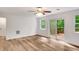 Bright living room with wood floors, ceiling fan, and sliding glass doors to a deck at 4368 Heritage Glen Ct, Marietta, GA 30068