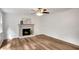 Light filled room has stylish wood flooring, neutral paint, white trim and a charming fireplace at 4368 Heritage Glen Ct, Marietta, GA 30068
