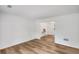 This living room has hardwood floors, white walls and an open doorway to an adjacent room at 4368 Heritage Glen Ct, Marietta, GA 30068