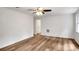 Sun-drenched living room features updated wood floors, ceiling fan, neutral paint, and white trim at 4368 Heritage Glen Ct, Marietta, GA 30068