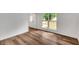 Bright room featuring hardwood floors, a window, and a white front door at 4368 Heritage Glen Ct, Marietta, GA 30068