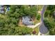 Aerial view of the home showcasing its layout, landscaping, and proximity to lush greenery at 5041 Corinault Nw Pl, Acworth, GA 30101