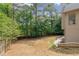 Expansive backyard with mature trees and a well-maintained fence, providing a private outdoor space at 5041 Corinault Nw Pl, Acworth, GA 30101