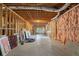 Unfinished basement with exposed ceiling, framing, and insulation offers a blank canvas for customization and expansion at 5041 Corinault Nw Pl, Acworth, GA 30101