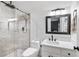Modern bathroom boasts walk-in shower, sleek fixtures, and ample lighting at 5041 Corinault Nw Pl, Acworth, GA 30101