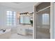 Bright bathroom with double vanity, soaking tub and glass-enclosed shower at 5041 Corinault Nw Pl, Acworth, GA 30101