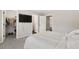 Bedroom with mounted TV, walk-in closet, and doorways to other rooms at 5041 Corinault Nw Pl, Acworth, GA 30101