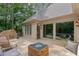 Outdoor deck featuring a stylish seating arrangement and fire pit, perfect for enjoying the serene natural surroundings at 5041 Corinault Nw Pl, Acworth, GA 30101