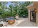 Outdoor deck featuring a stylish seating arrangement and grill, perfect for enjoying the serene natural surroundings at 5041 Corinault Nw Pl, Acworth, GA 30101