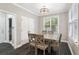 Cozy dining room with natural light, contemporary lighting, and neutral decor at 5041 Corinault Nw Pl, Acworth, GA 30101
