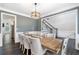 Dining room area with modern lighting, beautiful wood flooring, and direct access to kitchen at 5041 Corinault Nw Pl, Acworth, GA 30101