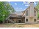 Rear exterior showcasing a spacious deck and walkout basement, ideal for outdoor living and entertaining at 5041 Corinault Nw Pl, Acworth, GA 30101